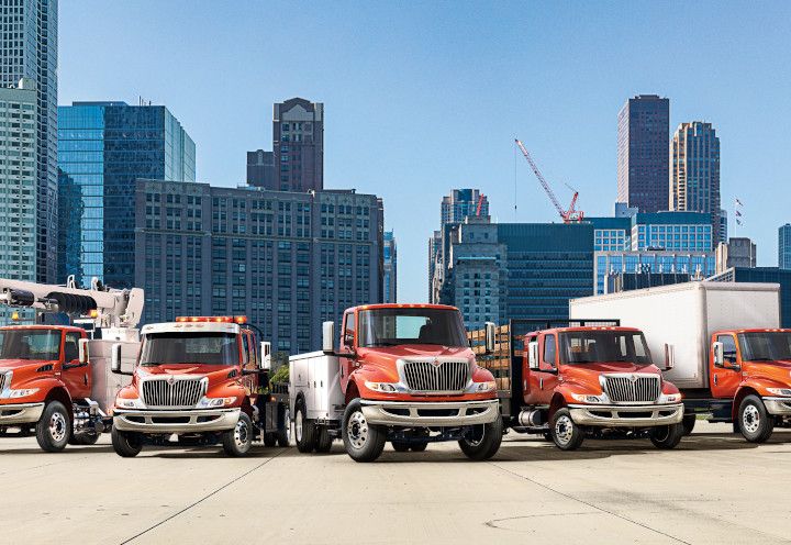 International MV Series Trucks against a city background