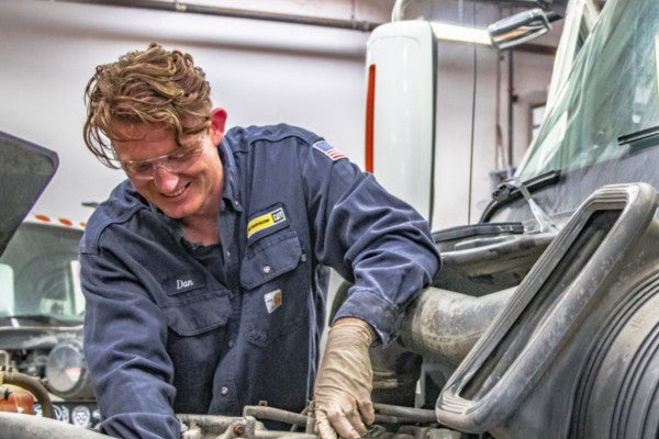 Technician working on truck